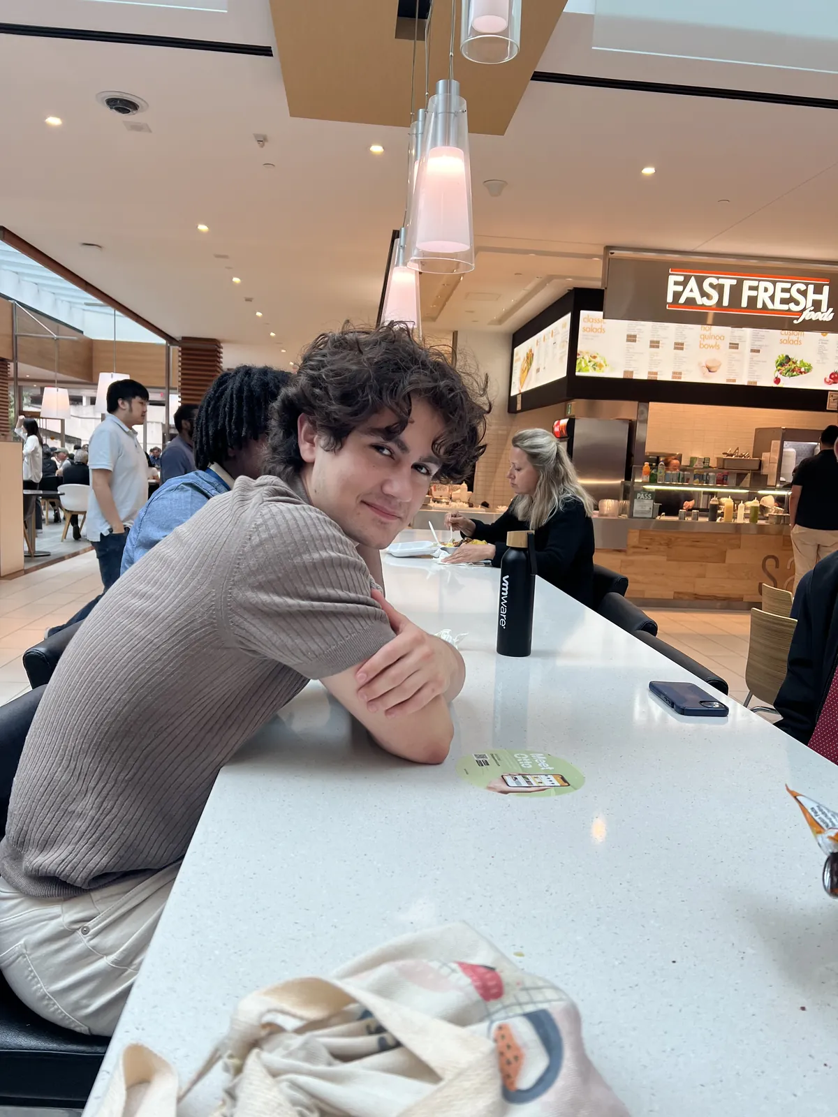The team spending time together in the food court.
